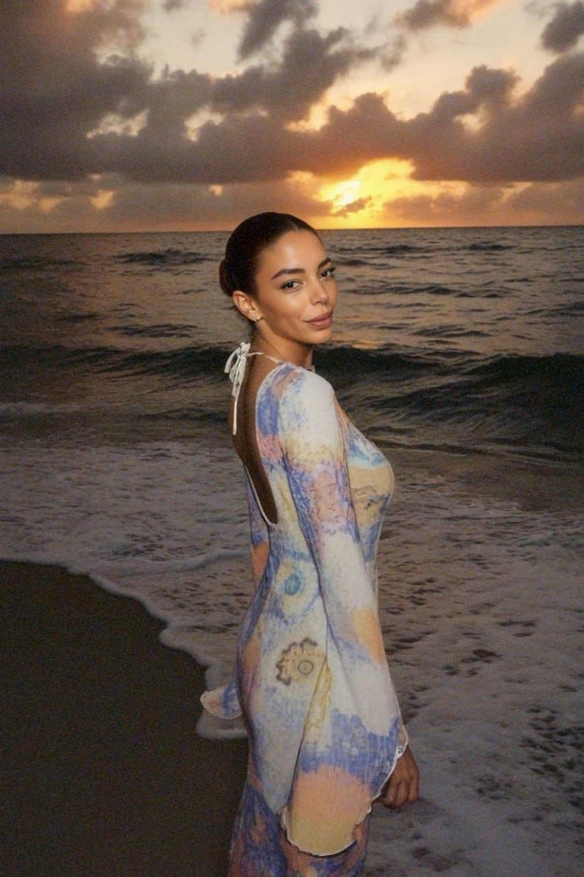 In profile at sunset, Luna wears a floor-length pastel tie-dye dress with an open back secured by a neck tie.